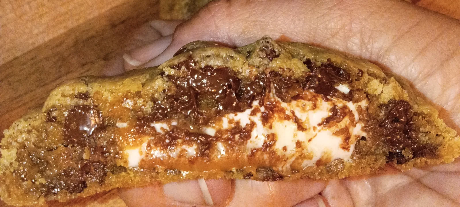 Chocolate covered caramel marshmallow stuffed chocolate chip cookies